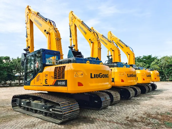 a row of yellow and blue construction machines